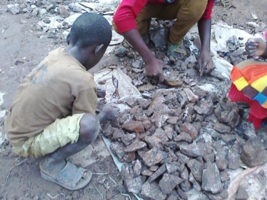 Children sorting and crushing cobalt ore in the neighbourhood of Kasulo, Kolwezi, DRC